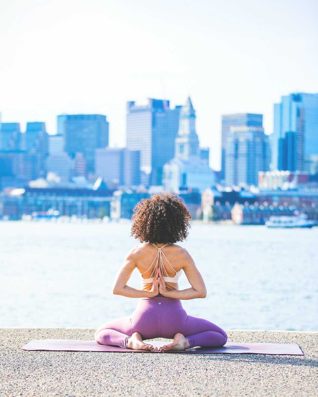 A woman doing a yoga pose dealing with stress as a film actor