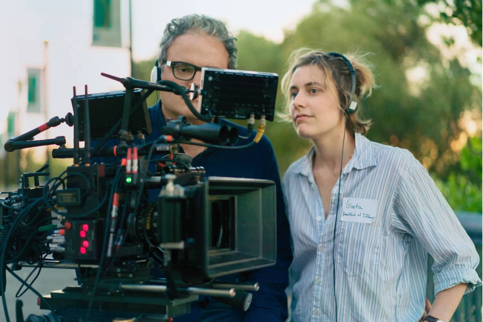 An example of how to direct a movie like Greta Gerwig showing Greta and a crew member on the cast of Lady Bird wearing name labels