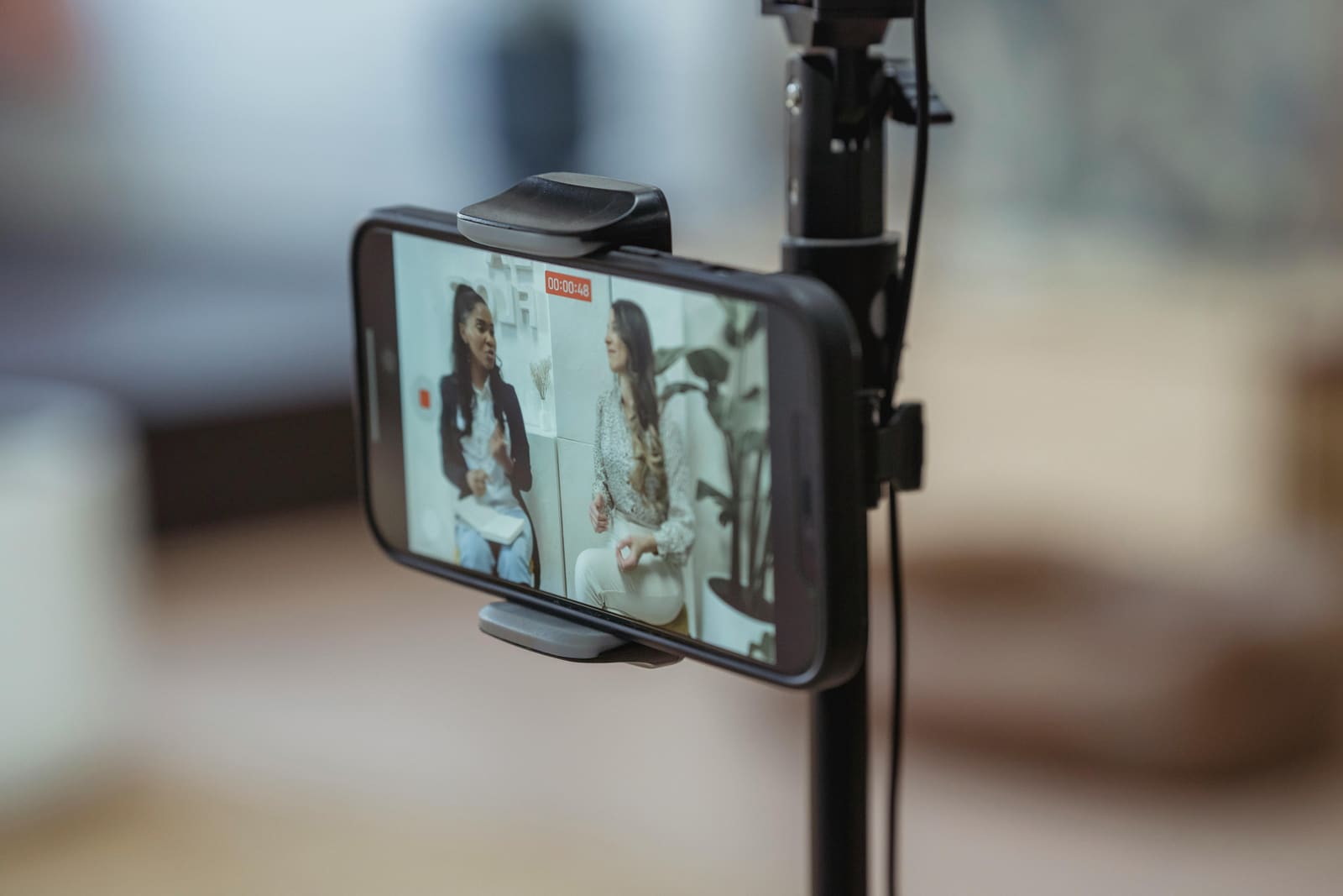 Smartphone on a tripod recording a conversation in a low-budget film.