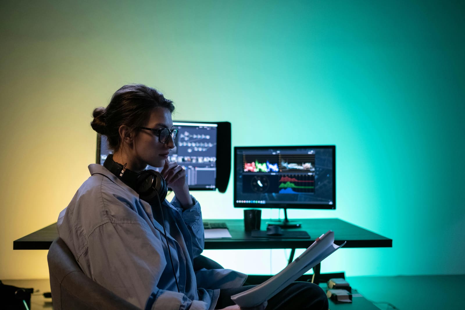 A filmmaker using a digital production management platform on a laptop to coordinate a film crew – representing the best platform to manage your independent film production.