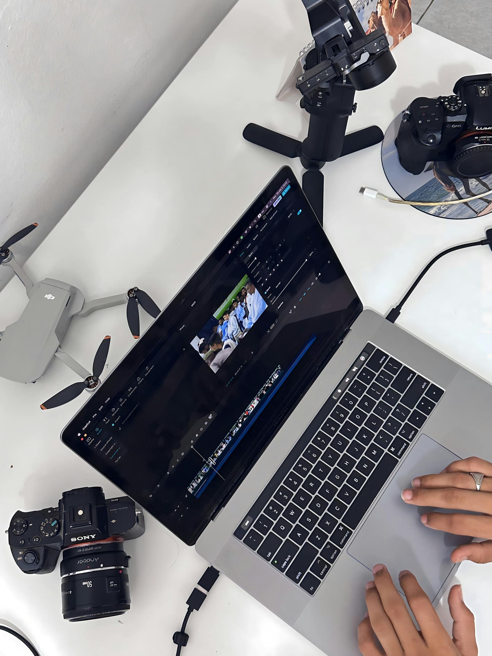 Filmmaker working on a laptop, accessing online filmmaking platforms