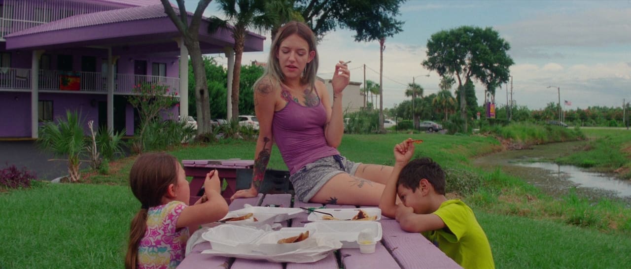 Independent filmmaker filming close to a subject on a city street, representing how Sean Baker gets closer than most filmmakers dare through intimacy and realism.